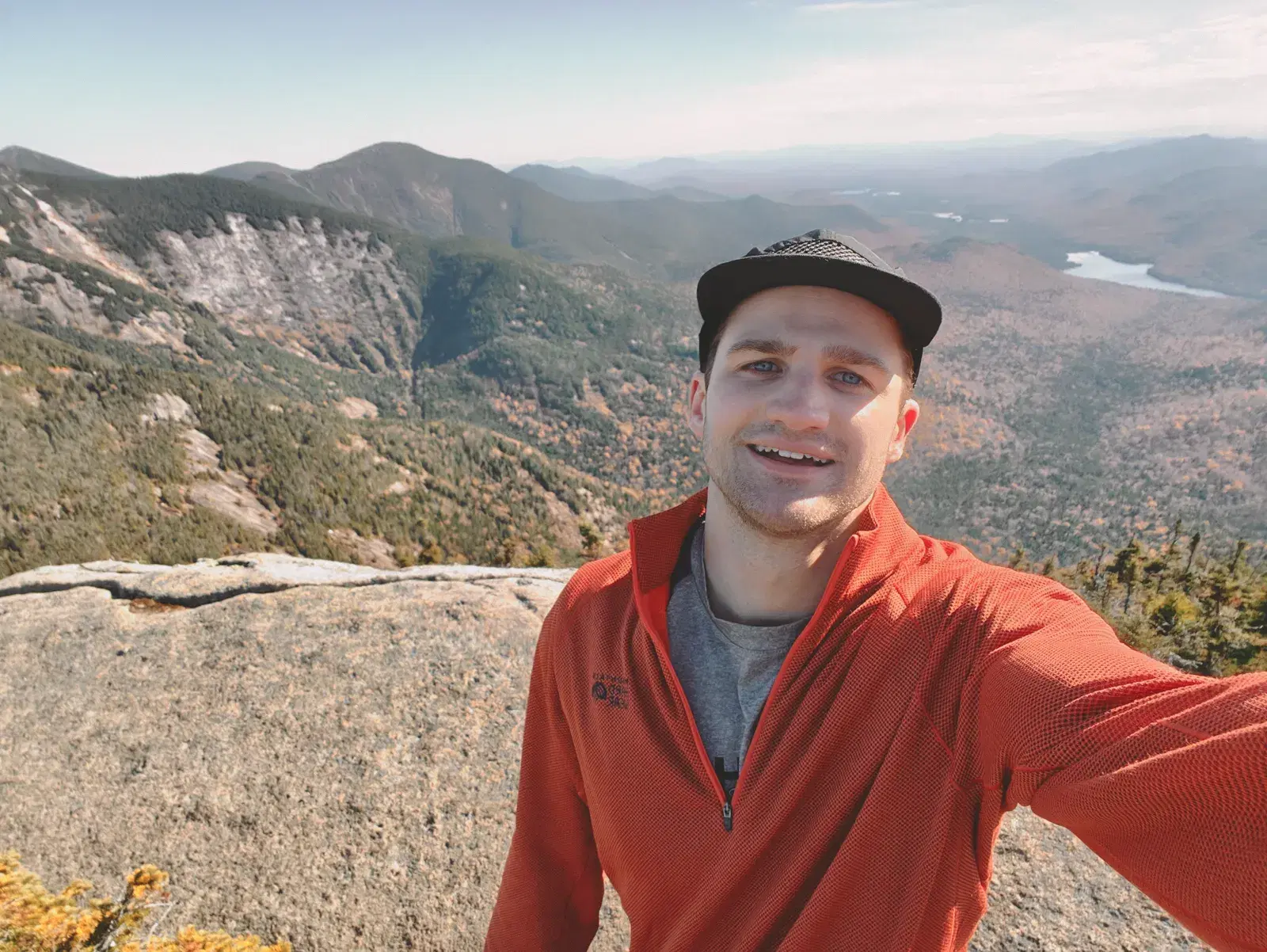 Everett McIntire standing in a mountain landscape